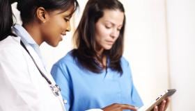 Doctor_and_nurse_looking_at_tablet